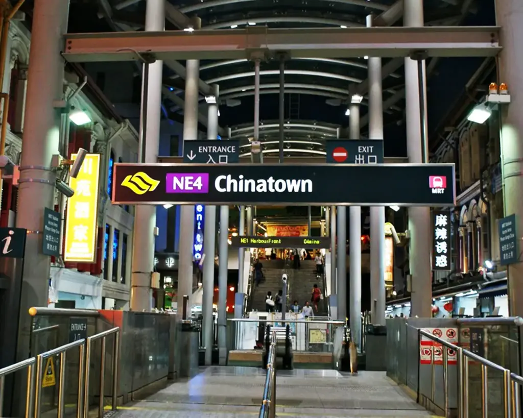 Chinatown MRT signage inside the station, displaying directions and line information that guide commuters and tourists navigating Singapore’s MRT network.