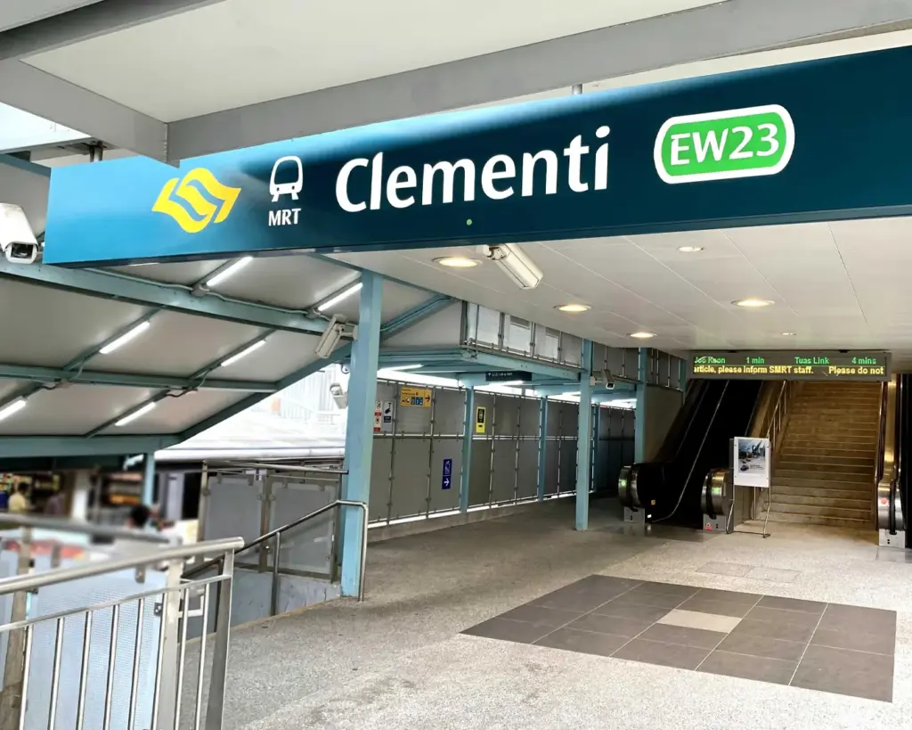 The exterior view of a busy MRT station with clear signage, sheltered walkways, and entering and exiting, reflecting daily commuter life in Singapore