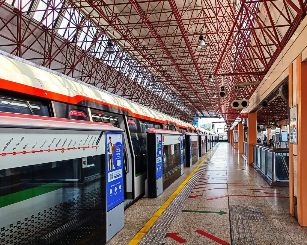 A view of Jurong East MRT station with trains, platforms, and commuters moving through one of Singapore’s major interchange stations.