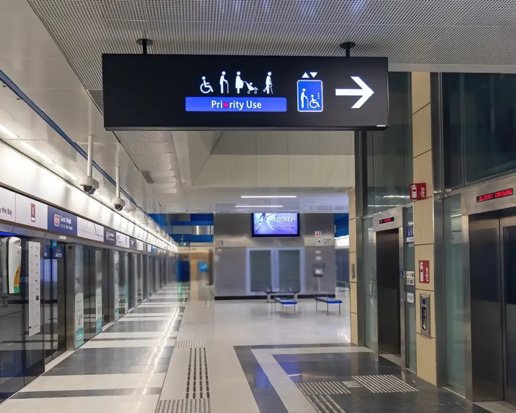 Priority seating signage inside Chinatown MRT Station reminding commuters to give seats to elderly passengers, pregnant women, and people with disabilities.