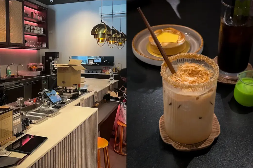 Modern minimalist specialty coffee bar interior in Singapore with warm pendant lighting, sleek white counters, wooden stools, and cozy cafe seating