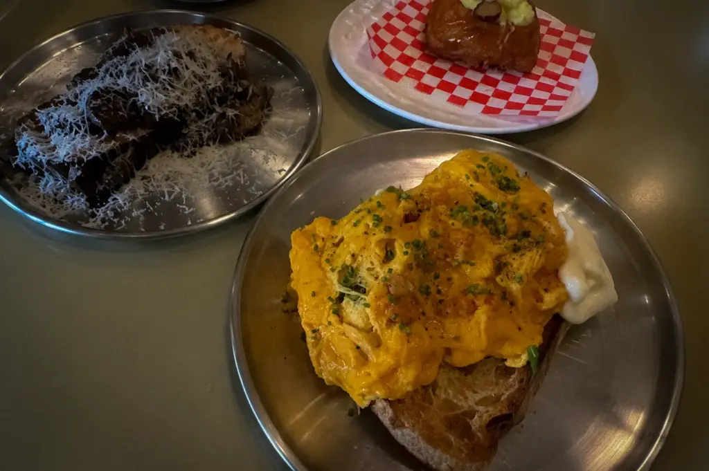 Shu Bakery Space@Kovan Singapore brunch with scrambled eggs on toast, chocolate pastry, and glazed croissant.