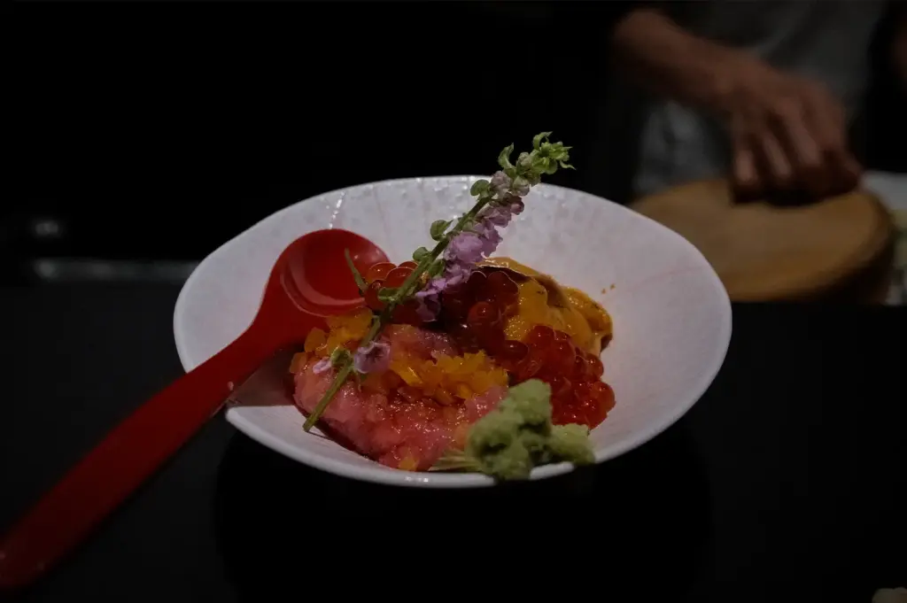 Sushi to Sumi Singapore Japanese seafood dish with sea urchin, tuna, salmon roe, wasabi, and edible flowers