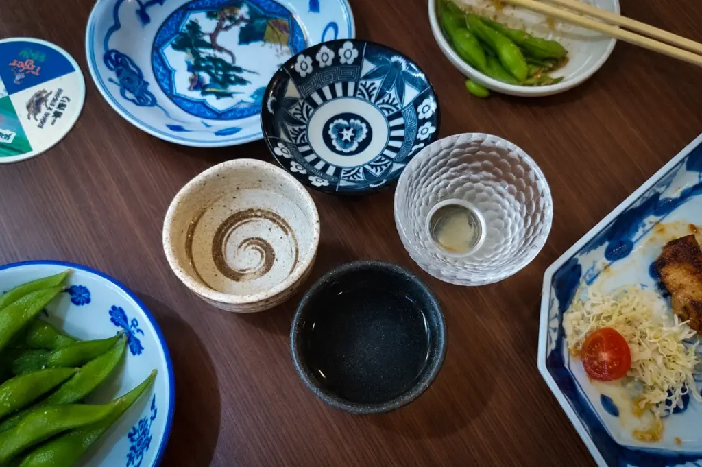 Sake served at Morinaga Izakaya Restaurant with Japanese side dishes and edamame.
