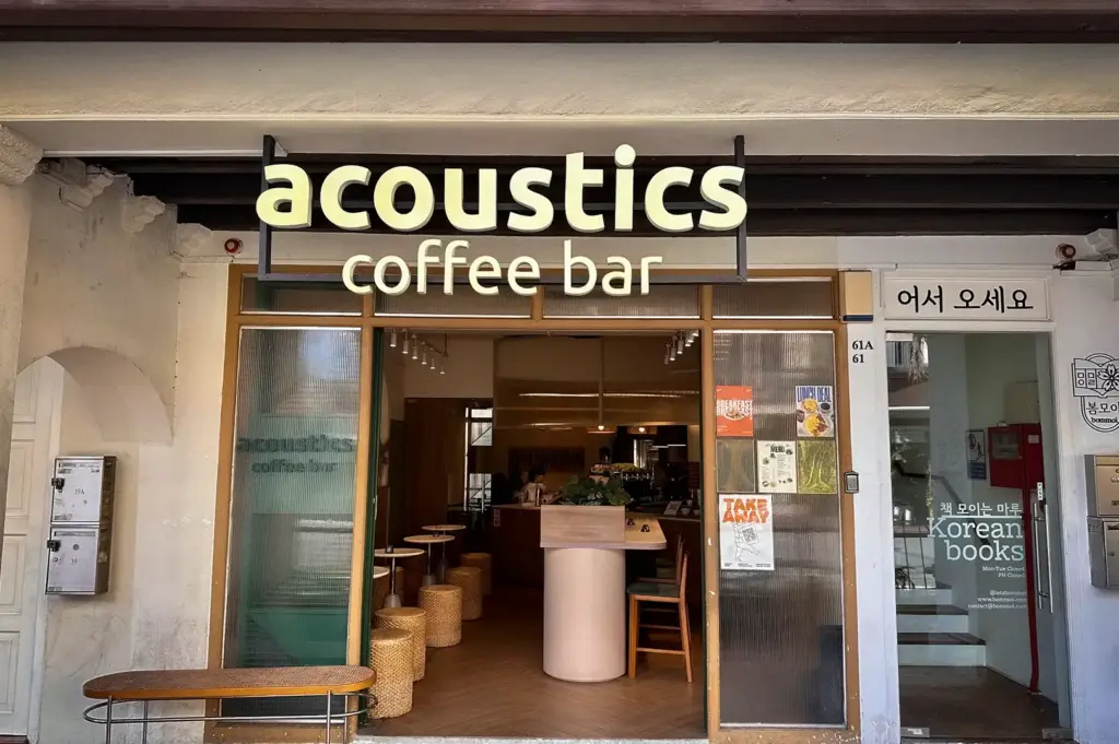 Front facade and entrance of Acoustics Coffee Bar and the adjacent Korean bookstore along Neil Road in Singapore
